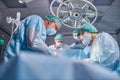 Operating room caucasian team of professional surgeons and nurses working together Royalty Free Stock Photo