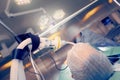 Operating room with working staff next to the patient Royalty Free Stock Photo