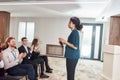 Operation Excellence. Audience applauding female speaker after her talk at business meeting, economic forum at Royalty Free Stock Photo