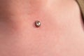 Operation to install microdermal piercing. Professional placing