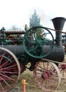 Operating old steam tractor showing moving flywheel