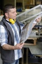 operative checking printing quality in printing factory Royalty Free Stock Photo