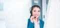 Operator asian woman working with headset in office,Beautiful smiling call center women Royalty Free Stock Photo