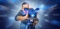Operator with a camera on an abstract technological background. Digital video technologies Royalty Free Stock Photo