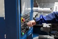 operator controls CNC lathe machining center