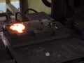 Operator forging steel automotive parts