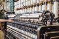 Operator hands on vintage automatic loom