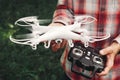 Operator holding remote control and quadrocopter Royalty Free Stock Photo