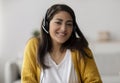 Operator of hot line. Portrait of friendly arab customer service representative wearing headset in call center Royalty Free Stock Photo