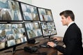 Operator Looking At Multiple Camera Footage Royalty Free Stock Photo