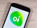 operator Oi logo on the smartphone screen. Oi previously known as Telemar, is a telecommunications services