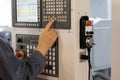 Operator prepares CNC machine for a new task Royalty Free Stock Photo