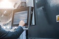 The operator presses buttons on the terminal for industrial sheet metal processing equipment Royalty Free Stock Photo