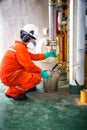 Operator recording operation of oil and gas process at oil and r Royalty Free Stock Photo