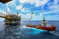 Operator recording operation of oil and gas process at oil and rig plant, offshore oil and gas industry, offshore oil and rig