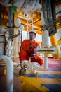 Operator recording operation of oil and gas process at oil and r Royalty Free Stock Photo