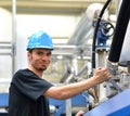 Operator repairs a machine in an industrial plant with tools - p Royalty Free Stock Photo