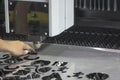 The operator setup metal plate on fiber laser cutting machine.