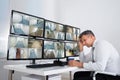 Operator Sleeping While Leaning On Security Monitor`s Desk Royalty Free Stock Photo