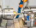 Operator turning and grinding brass autopart by cnc lathe