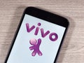 Operator Vivo logo on the smartphone screen. Vivo is a trademark of TelefÃÂ´nica Brasil