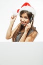 Operator woman worker. Blank white board. Christmas Santa hat. Royalty Free Stock Photo