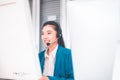 Operator women working with headset at workplace,Beautiful smiling call center woman Royalty Free Stock Photo