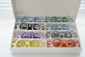 Ophthalmic glasses with lenses are folded into the cells of the case