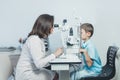 Ophthalmologist checks the boy`s vision. Vision tests in children. Hyperopia