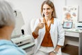 Ophthalmologist consulting senior woman in the office Royalty Free Stock Photo