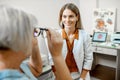 Ophthalmologist consulting senior woman in the office Royalty Free Stock Photo