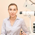 Ophthalmologist doctor in exam optician laboratory with female patient. Eye care medical diagnostic. Eyelid treatment Royalty Free Stock Photo