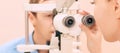 Ophthalmologist doctor in exam optician laboratory with male patient. Men eye care medical diagnostic. Eyelid treatment Royalty Free Stock Photo