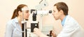 Ophthalmologist doctor in exam optician laboratory with male patient. Men eye care medical diagnostic. Eyelid treatment Royalty Free Stock Photo