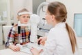 ophthalmologist examines the girl on a corneo topographer. modern clinic.