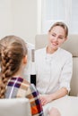 ophthalmologist examines the girl on a corneo topographer. modern clinic.