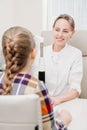 ophthalmologist examines the girl on a corneo topographer. modern clinic.