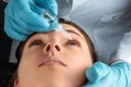 An ophthalmologist injects drops into the eyes of patients in an ophthalmic clinic. Health, vision, eye disease