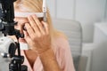 Doctor examines woman eye health in the cabinet