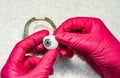 Ophthalmologist or surgeon holds in hand dressed in a blue glove eye (eyeball) Royalty Free Stock Photo