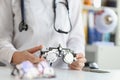Ophthalmologist with trial frame for selection of complex astigmatic glasses Royalty Free Stock Photo