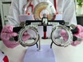 Ophthalmologist with trial frame for selection of complex glasses Royalty Free Stock Photo