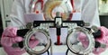 Ophthalmologist with trial frame for selection of complex glasses Royalty Free Stock Photo