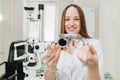 ophthalmologist with trial frame for selection of glasses. selective focus Royalty Free Stock Photo