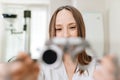 ophthalmologist with trial frame for selection of glasses. selective focus Royalty Free Stock Photo