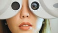 Ophthalmology clinic - woman checks vision by modern equipment - left eye