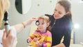 Ophthalmology - doctor checks eyesight at little girl - child`s healthcare Royalty Free Stock Photo