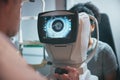 Ophthalmology, eye scan and woman with a doctor for a consultation, vision test and lens check. Surgery, medicine and Royalty Free Stock Photo
