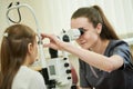 ophthalmology. female doctor checks eyesight of child. BeH3althy Royalty Free Stock Photo