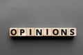 Opinions - word from wooden blocks with letters